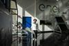 Enel's head of the advanced processes and materials characterization lab poses next to a state-of-the-art photovoltaic panel